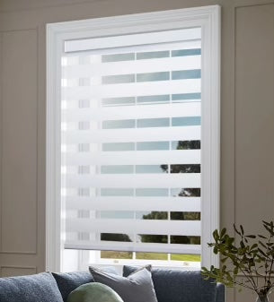 Custom-fit zebra blinds installed on a large living room window